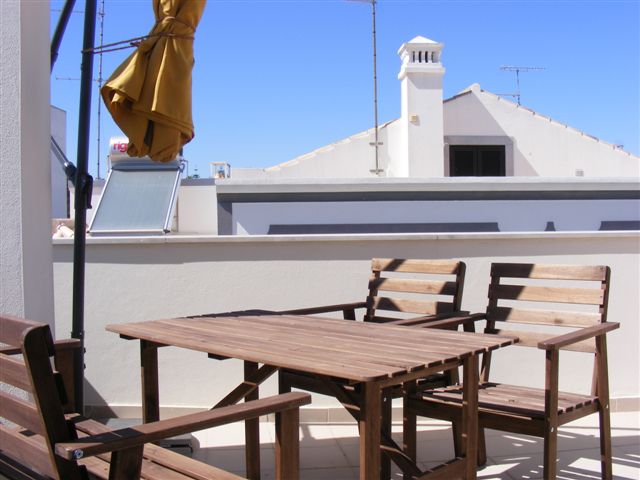 Large terrace with parasol, table and chairs for 'alfresco dining'