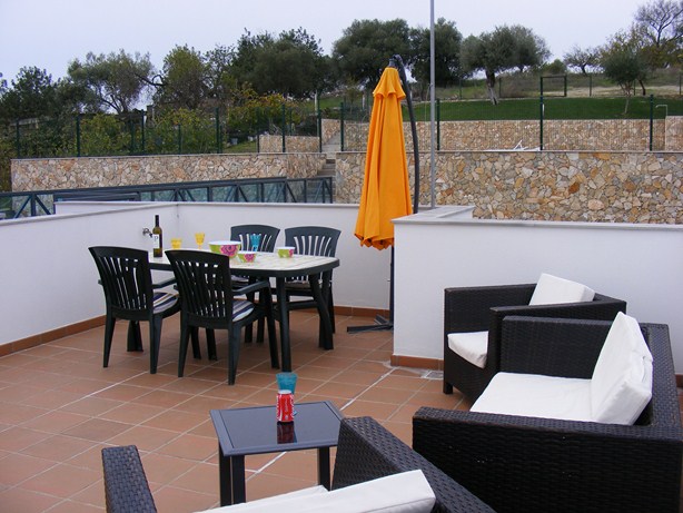 Large private roof terrace with table & chairs, parasol and comfortable seating area