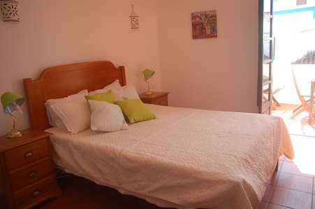 Good size double bedroom with built in wardrobes and access to sun terrace with outdoor furniture