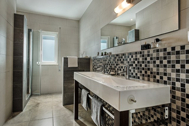 Good size bathroom with double vanity and walk-in shower